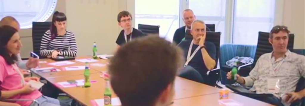 People around a conference table attending a measure camp